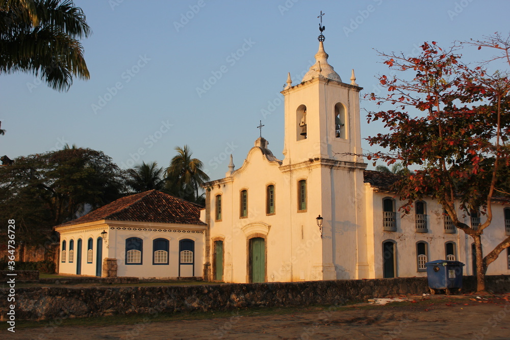 Colonial style church in the middle of old buildings, Portuguese constructions in Paraty, Brazil