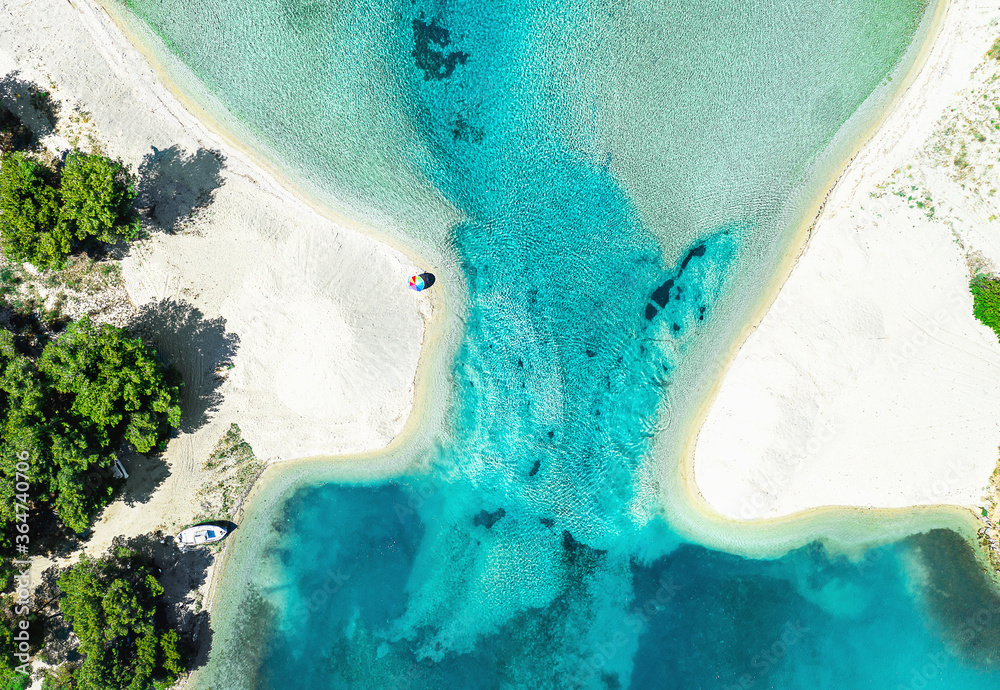 Aerial photo of white beach and blue sea lagoon at Halkidiki peninsula, Greece. Summer background.