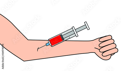 taking blood from human arm using a syringe