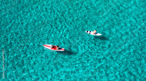 Unrecognizable people having fun with sub boards in the sea, aerial view. © 22Imagesstudio