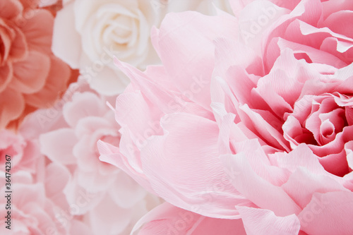 flower is made from corrugated paper, floral background in warm colors