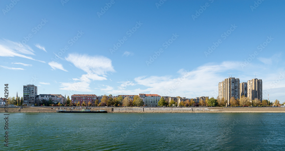 Novi Sad, Vojvodina: Danube panoramic city view. Residental buildings and boat.