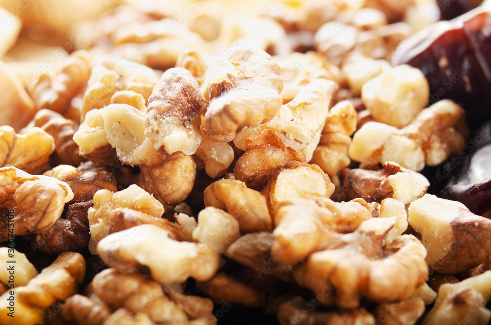 Closeup view at walnut nuts on kitchen table. Vegetarian food concept Closeup view at walnut nuts on kitchen table. Vegetarian food concept
