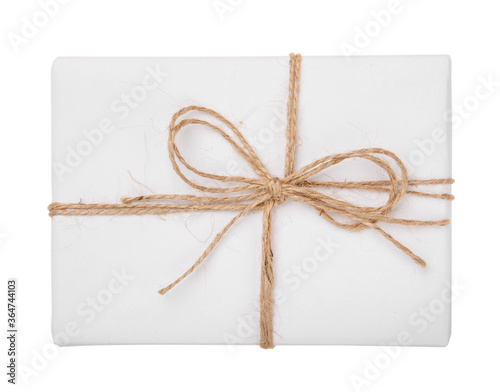 Gift wrapped in paper with ribbon bow on a white background.