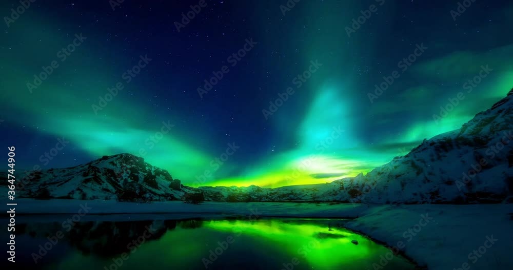 Winter landscape northern lights aurora borealis over the lake