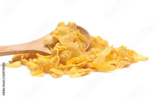Cornflakes on spoon wood isolated on white background