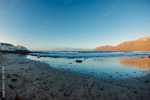 Famara beach and mountains with sunset tones in Lanzarote