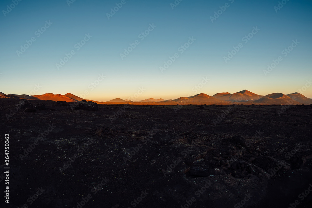Volcanic landscape with volcanos at sunset tones in Lanzarote
