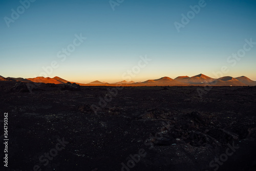 Volcanic landscape with volcanos at sunset tones in Lanzarote