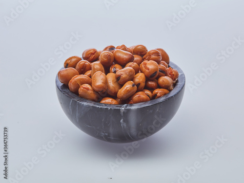 Fava beans (foul) shot on white background.