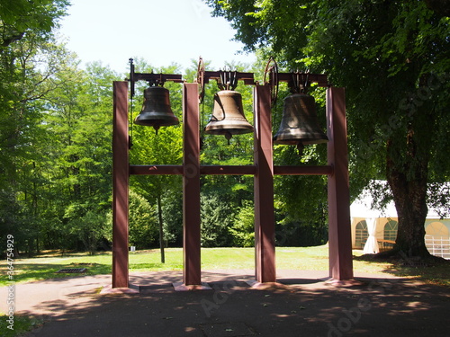 Beautiful bell beside the Longchamp chapel on a sunny day