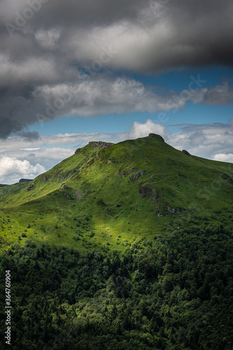  the view from pas de peyrol , a mountain pass in auvergne, cantal France , landcape ,with cloudy sky ,walking ,adventure holiday.