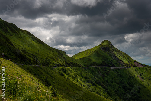 mountain road or  pass , pas de peyrol ,auvergne, cantal France , landcape , with cloudy sky ,walking ,adventure holiday. photo