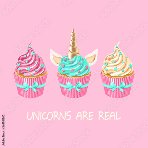 Festive unicorn cupcakes set.  Cake with golden horn and cream on pink background