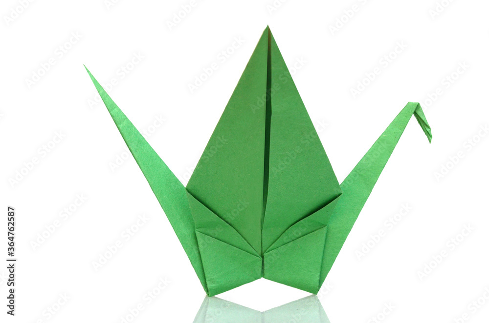 Green origami paper folded isolated white Green origami paper folded isolated white