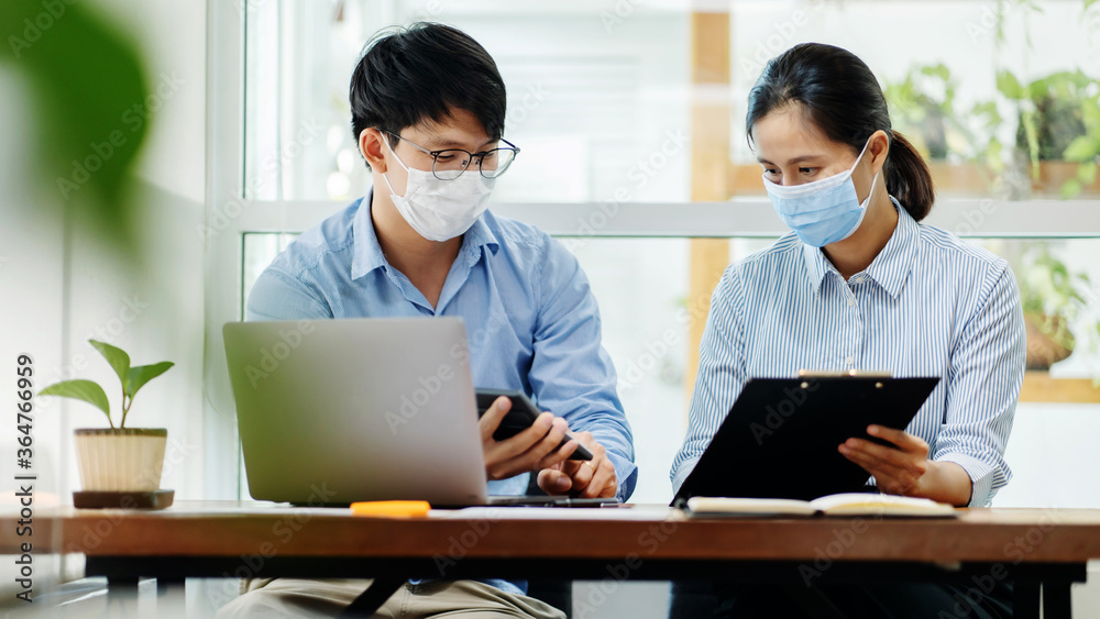 Asian business people wearing facial medical mask for protect COVID-19. Asian business people wearing facial medical mask for protect COVID-19.