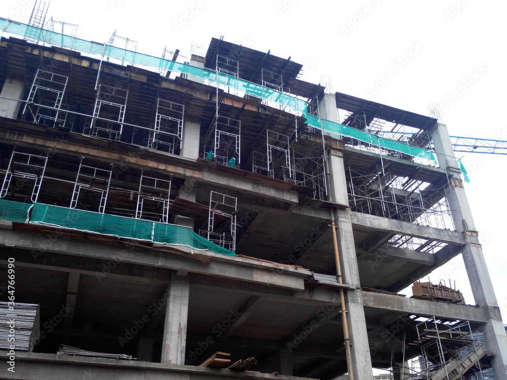 SEREMBAN, MALAYSIA -MARCH 7, 2020: Steel reinforced concrete structure is built at the construction site. Built using formworks made of wood and plywood. Manually build by the workers.