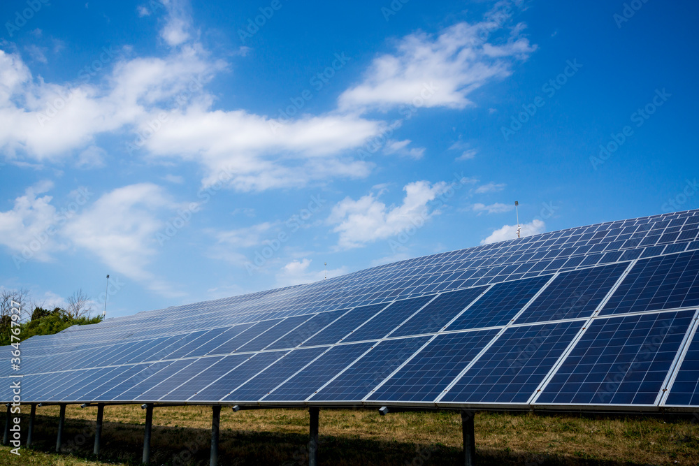 Solar panels with background of blue sky and clouds Solar panels with background of blue sky and clouds