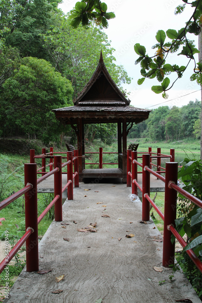 Traditional pavillion on water in Wat Doi Mae Pang, a Buddhist temple in Phrao district, Chiang Mai Province, northern Thailand.