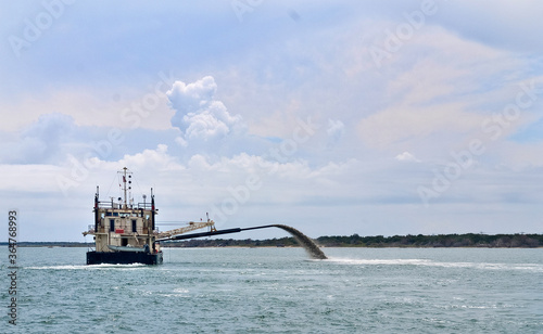 Dredger at sea along the shores of the Outer Banks North Carolina. photo