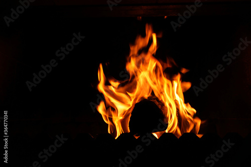 Fire flame on black background. Blaze fire flame textured background. Texture of fire on a black background. Abstract Fire flames isolated 