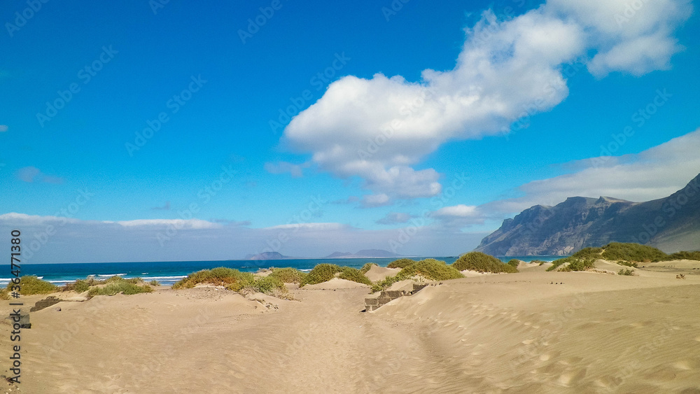 Beach and mountains - beautiful coast in Caleta de Famara, Lanzarote Canary Islands.