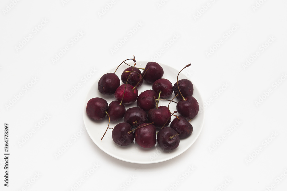 Fresh red Cherries on the dish isolated Fresh red Cherries on the dish isolated