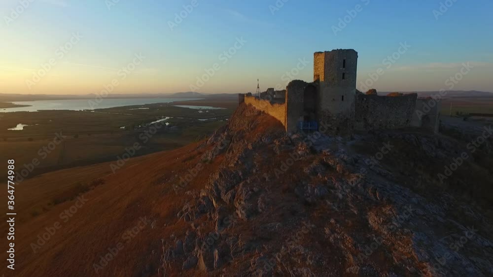 Enisala fortress in Romania, drone shot at sunset, flying above the fortress.Slow motion Enisala fortress in Romania, drone shot at sunset, flying above the fortress.Slow motion