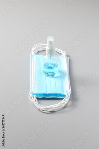 Surgical face mask, vector illustration. Blue medical protective masks, from different angles isolated on white. Corona virus protection mask with ear loop, in a front, three-quarters, and side views.