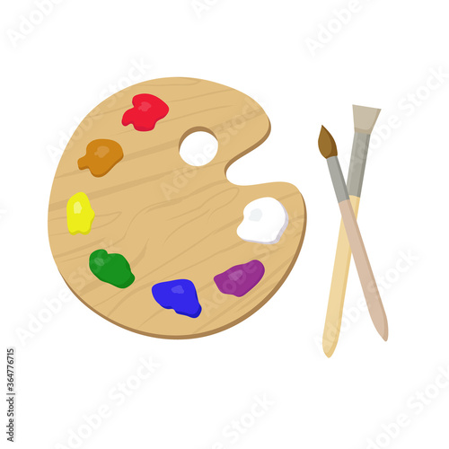 Wooden art palette with paints, and brushes for drawing. Items for creativity and learning