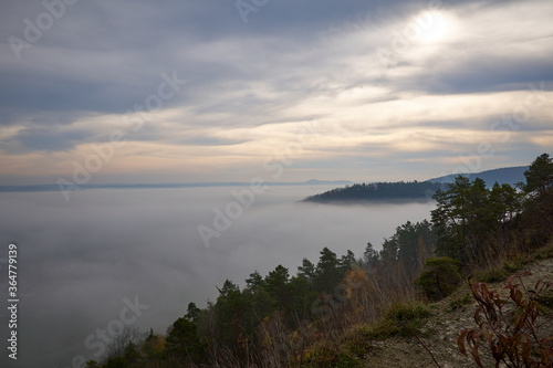 Fototapeta Naklejka Na Ścianę i Meble -  sunset over the misty hills