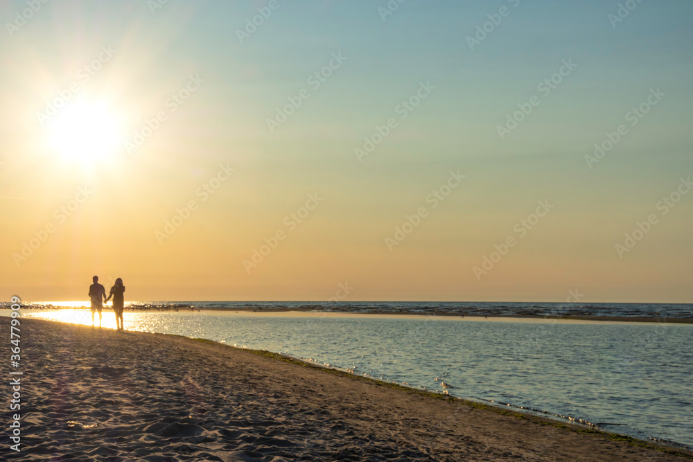 Fototapeta premium couple of two people in love at sunset