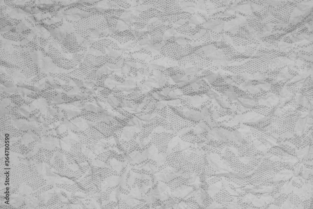 Fototapeta premium Gray wrinkled textured paper background with lace overlay