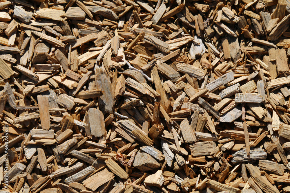 a detailed closeup angle shot view looking down at some shredded wood chip dry mulch ground covering perfect for garden and gardening background as well as nature backdrops a detailed closeup angle shot view looking down at some shredded wood chip dry mulch ground covering perfect for garden and gardening background as well as nature backdrops