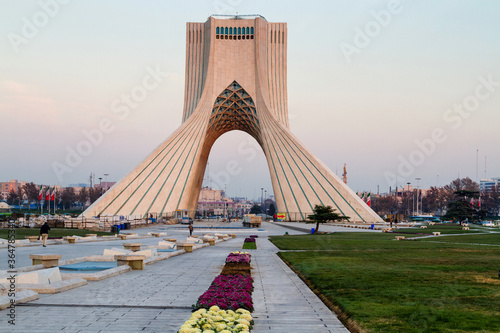 TEHRAN, IRAN - NOVEMBER 25, 2016: View of the Azadi Tower in the light of the setting sun. The tower is one of the symbols of the city and Azadi Square most visited place by tourist. photo