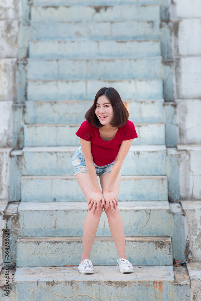 Portrait of asian woman sit on the road,Beautiful thailand people,Happy woman concept,Lifestyle of modern girl Portrait of asian woman sit on the road,Beautiful thailand people,Happy woman concept,Lifestyle of modern girl