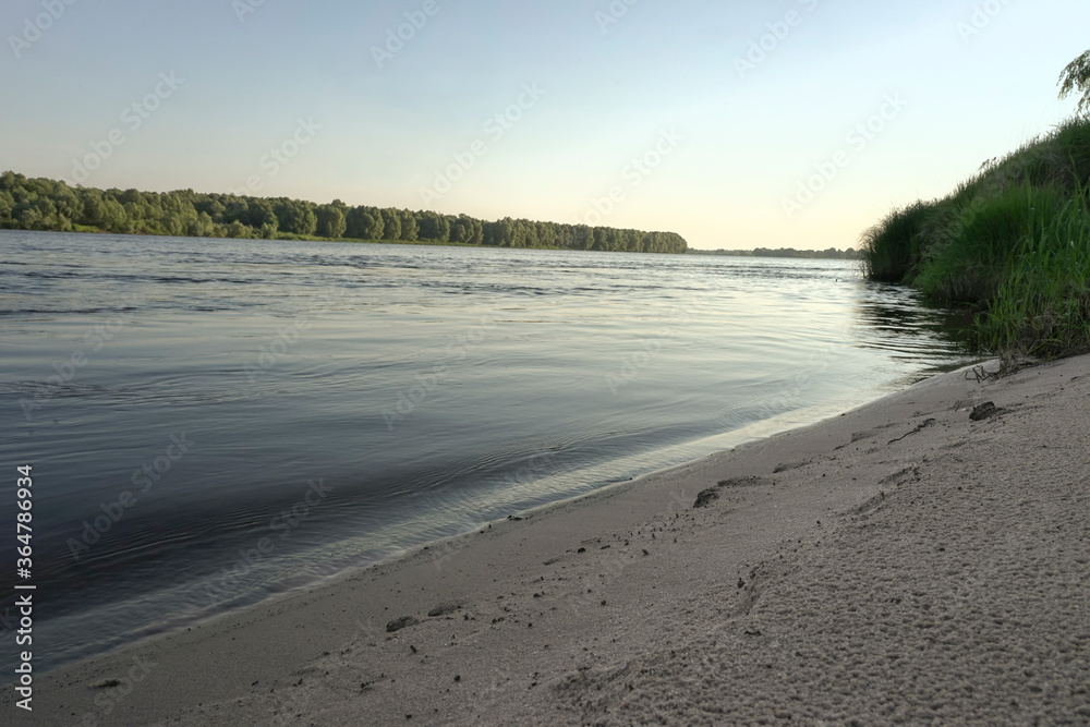 sunrise on the banks of a large river sunrise on the banks of a large river