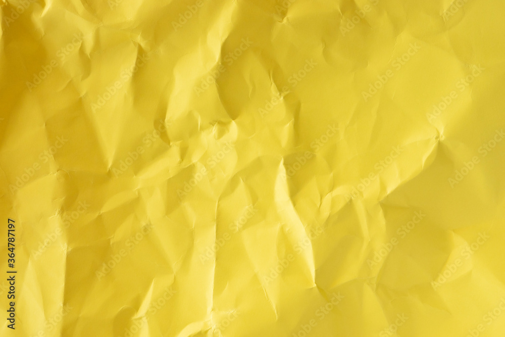 Crumpled yellow paper texture flat lay Crumpled yellow paper texture flat lay