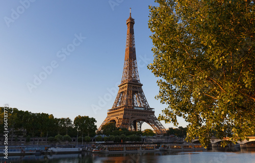 Eiffel Tower, iconic Paris landmark with vibrant blue sky © kovalenkovpetr