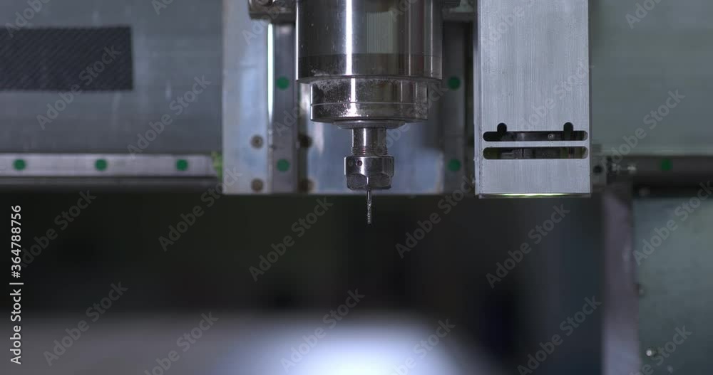 Close-up, equipment at the factory, cnc. Drill of a mill starts to work, cuts out a detail, shavings fly. Close-up, equipment at the factory, cnc. Drill of a mill starts to work, cuts out a detail, shavings fly.
