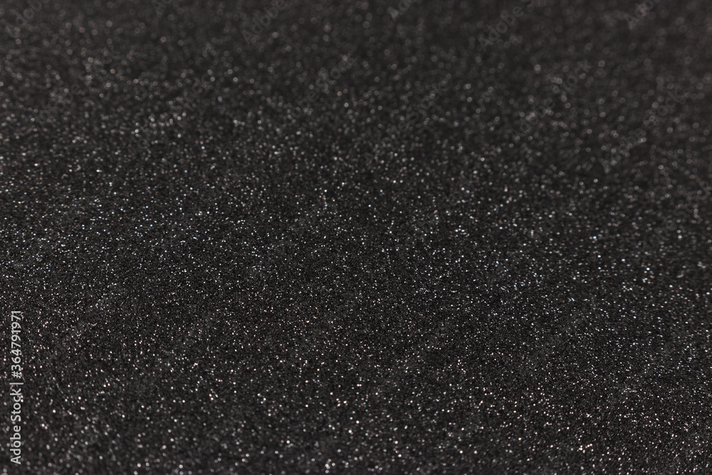 Obraz premium Black glitter texture background. Shiny dark defocused backdrop.