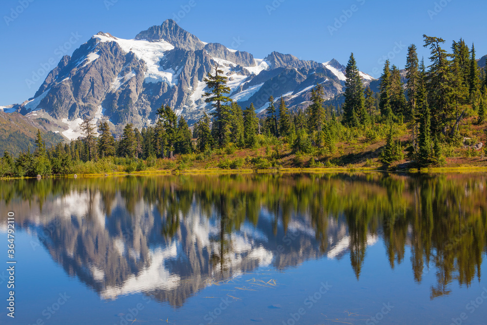 Mt. Shuksan and reflections in Picture Lake in autumn in Washington state