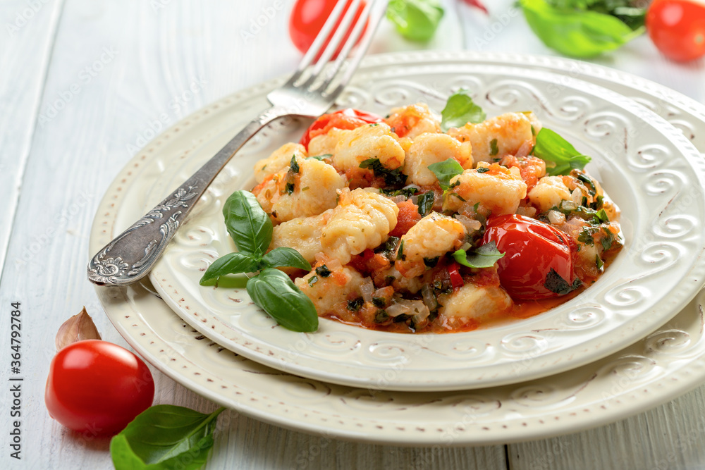 Traditional potato gnocchi with tomato sauce. Traditional potato gnocchi with tomato sauce.