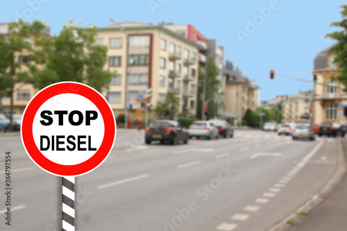 Stop sign for diesel cars in city, introducing ban on production and trade of diesel cars, development of alternative energy, ecology, environmental protection
