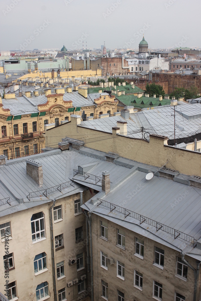 Saint-Petersburg, Russia - 10.06.20. Cityscape panorama of old central city part, view from a roof. Famous rooftops of St. Petersburg with Saint Isaac's Cathedralat the background.