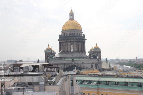 Saint-Petersburg, Russia - 10.06.20. Cityscape panorama of old central city part, view from a roof. Famous rooftops of St. Petersburg with Saint Isaac's Cathedralat the background. © Светлана Кокорина