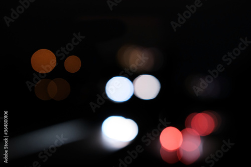 beautiful mysterious, blurry lights move smoothly in the dark, background for designers, travel concept, work at night, traffic © kittyfly