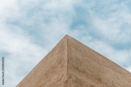 View of the edge of a building wall against the blue sky