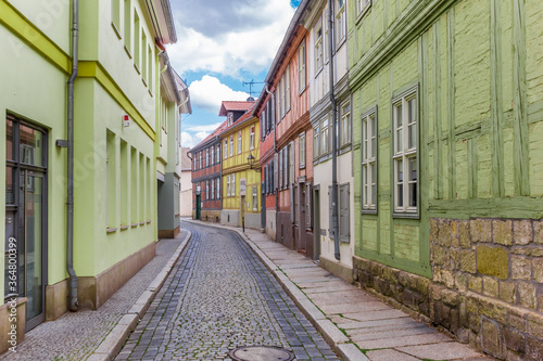 Fototapeta Naklejka Na Ścianę i Meble -  Empty cobblestoned street in the historic center of Quedlinburg, Germany