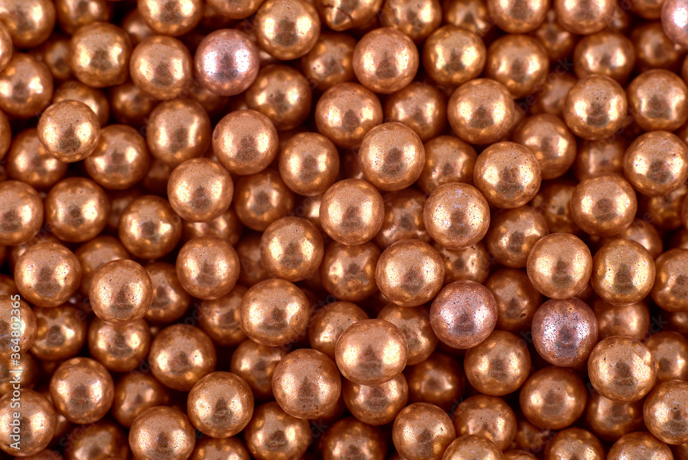 Golden round dots candies abstract background, copy space. Sweets texture. Top view, flat lay Golden round dots candies abstract background, copy space. Sweets texture. Top view, flat lay